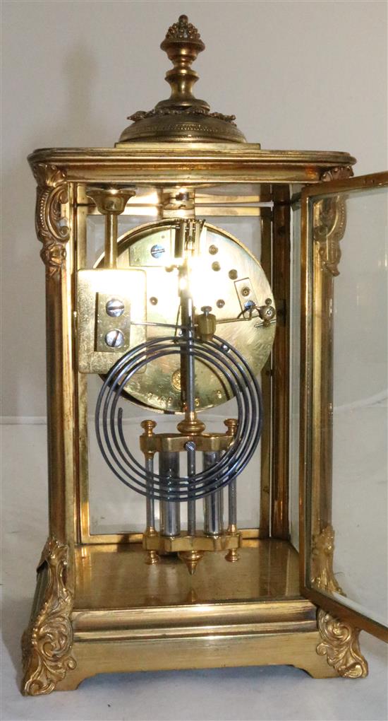 An early 20th century French ormolu four glass mantel clock, height 10in.